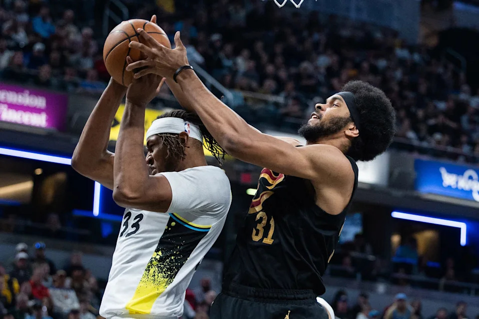 Apr 10, 2025; Indianapolis, Indiana, USA; Indiana Pacers center Myles Turner (33) and Cleveland Cavaliers center Jarrett Allen (31) fight for a rebound in the first half at Gainbridge Fieldhouse. Mandatory Credit: Trevor Ruszkowski-Imagn Images