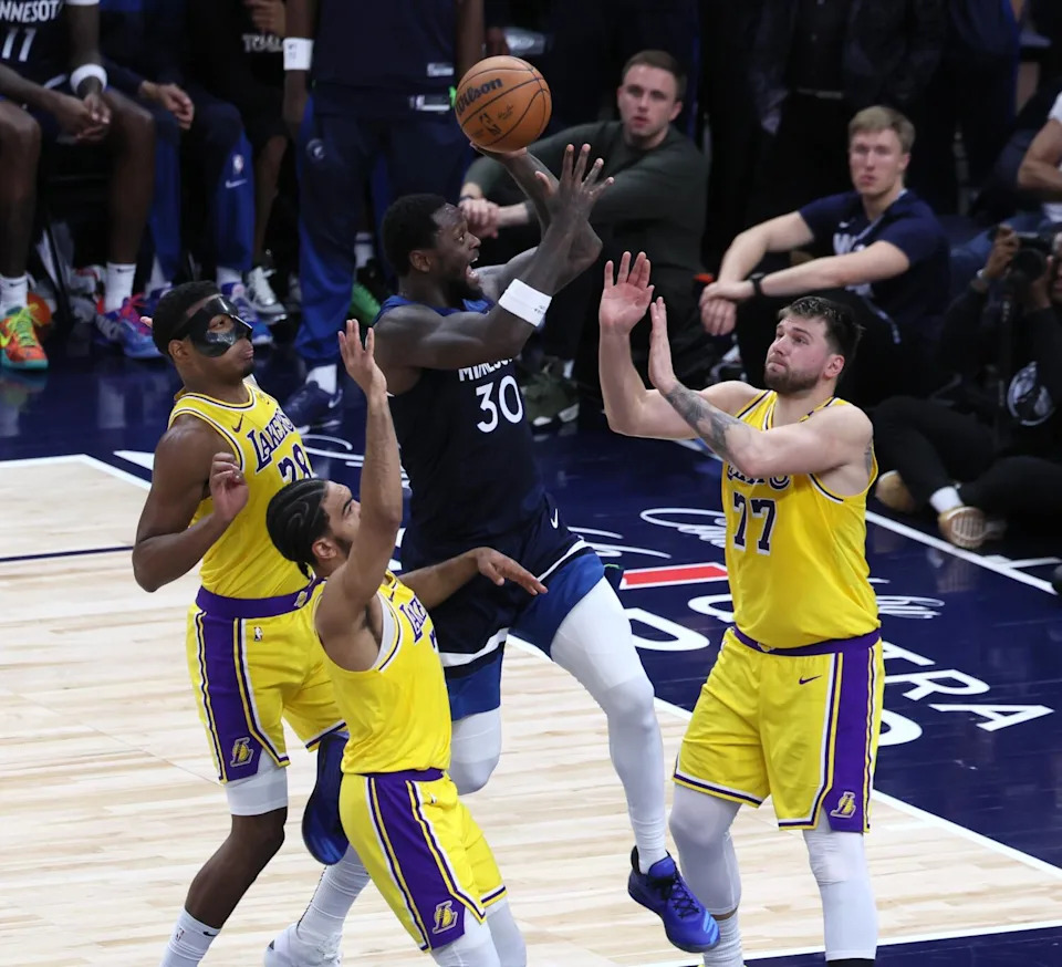 Timberwolves forward Julius Randle shoots over Lakers forward Rui Hachimura, guard Gabe Vincent and guard Luka Doncic