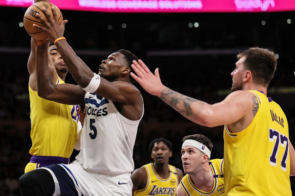 Los Angeles, CA, Tuesday, April 22, 2025 - Minnesota Timberwolves guard Anthony Edwards (5) drives past Los Angeles Lakers forward Rui Hachimura (28), Austin Reaves  (15) and Luka Doncic (77) in game two of the NBA first playoff round at Crypto.com Arena.  (Robert Gauthier/Los Angeles Times via Getty Images)