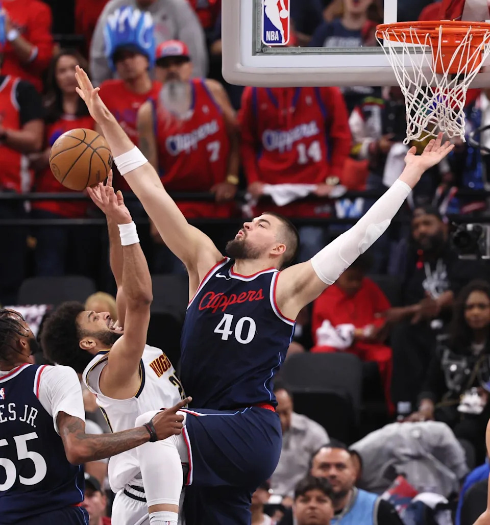 Clippers center Ivica Zubac, right, blocks a layup by Nuggets guard Jamal Murray, right, during Game 4 on Saturday.