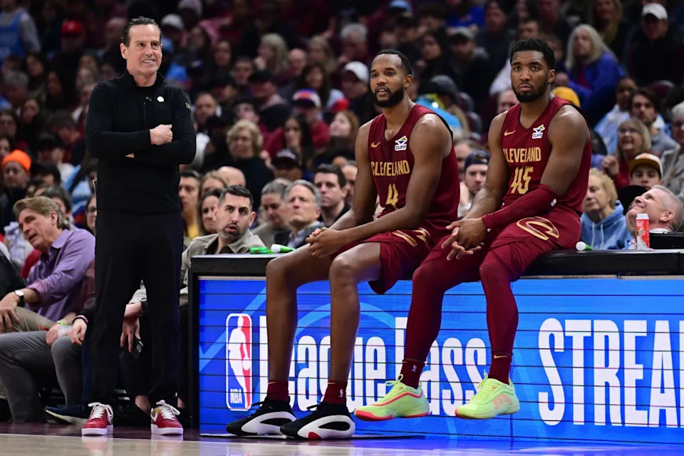 Cleveland Cavaliers forward Evan Mobley (4) and guard Donovan Mitchell (45) wait along side head coach Kenny Atkinson to enter the game during the first half against the New York Knicks at Rocket Arena. Mandatory Credit: Ken Blaze-Imagn ImagesCredit: Ken Blaze-Imagn Images