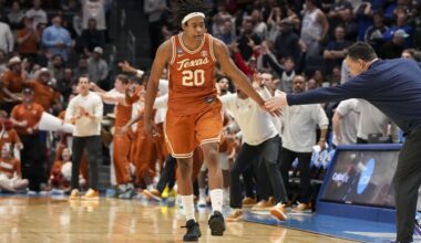 Texas guard Tre Johnson (20) celebrates with Xavier head coach Sean Miller after scoring during the second half of a First Four college basketball game in the NCAA Tournament, Wednesday, March 19, 2025, in Dayton, Ohio. (AP Photo/Jeff Dean)
