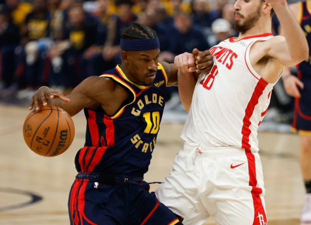 Golden State Warriors' Jimmy Butler III (10) dribbles against Houston...