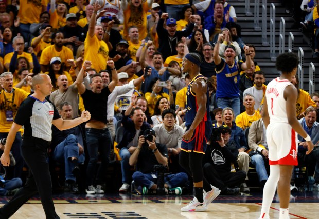 Golden State Warriors' Jimmy Butler III (10) celebrates his basket...