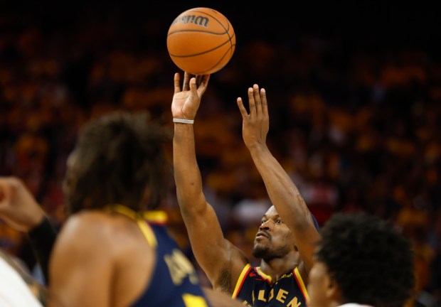 Golden State Warriors' Jimmy Butler III (10) shoots his second...