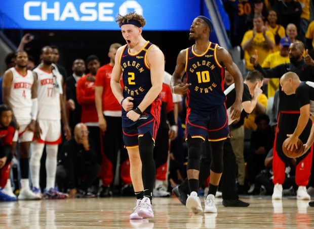 Golden State Warriors' Brandin Podziemski (2) and Golden State Warriors'...