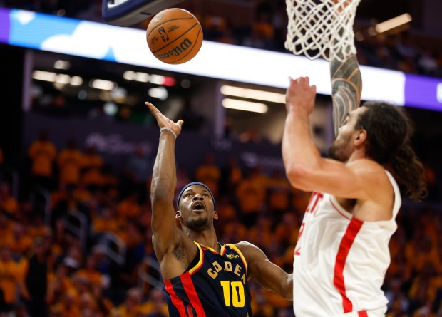 Golden State Warriors' Jimmy Butler III (10) takes a shot...