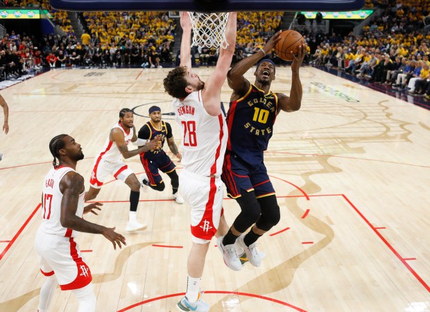 Golden State Warriors' Jimmy Butler III (10) takes a shot against Houston Rockets' Alperen Sengun (28) in the fourth quarter of Game 4 of the Western Conference First Round NBA Playoffs game at the Chase Center in San Francisco, Calif., on Monday, April 28, 2025. (Nhat V. Meyer/Bay Area News Group)