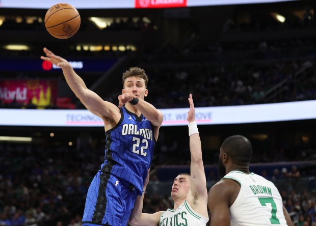 Orlando forward Franz Wagner (22) passes over Boston guard Jaylen...