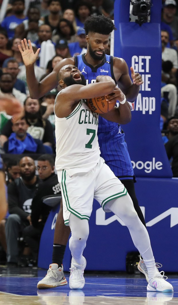 Boston guard Jaylen Brown (7) and Orlando forward Jonathan Isaac...