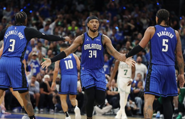 Orlando guard Kentavious Caldwell-Pope (3), center Wendell Carter Jr. (34),...