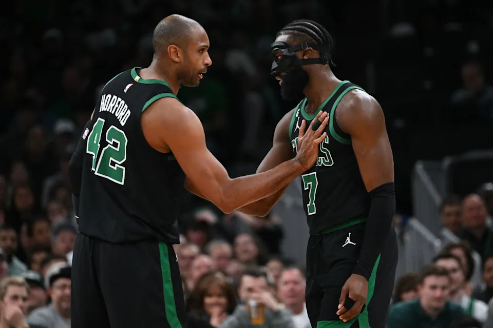Boston Celtics center Al Horford (42) high-fives guard Jaylen Brown (7).Brian Fluharty-Imagn Images