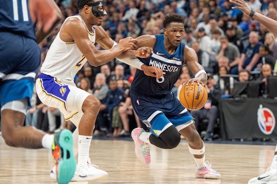 Apr 27, 2025; Minneapolis, Minnesota, USA; Minnesota Timberwolves guard Anthony Edwards (5) drives to the basket with Los Angeles Lakers forward Rui Hachimura (28) and forward Dorian Finney-Smith (17) on defense in the third quarter during game four of first round for the 2025 NBA Playoffs at Target Center. Mandatory Credit: Matt Blewett-Imagn Images