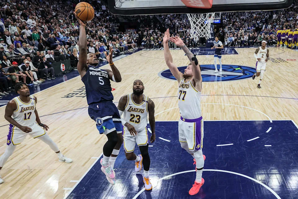 Minneapolis, Minnesota, Sunday, April 27, 2025 - Minnesota Timberwolves guard Anthony Edwards (5) shoots over Lebron James (23) and Luka Doncic (77) in game three of the NBA playoffs, at the Target Center.  (Robert Gauthier/Los Angeles Times via Getty Images)