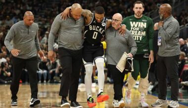 Bucks guard Damian Lillard helped off court after suffering injury in Game 4