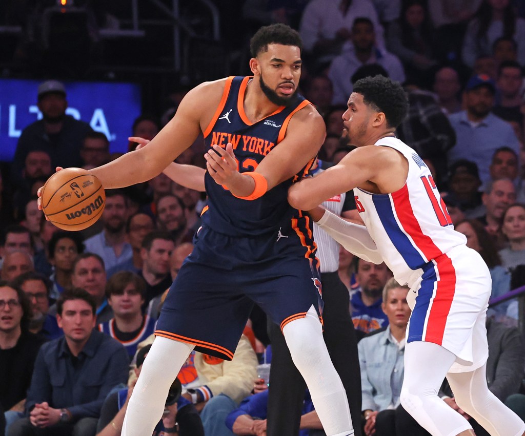 Knicks center Karl-Anthony Towns (l.) is defended by Pistons forward Tobias Harris (r.) in Game 2.