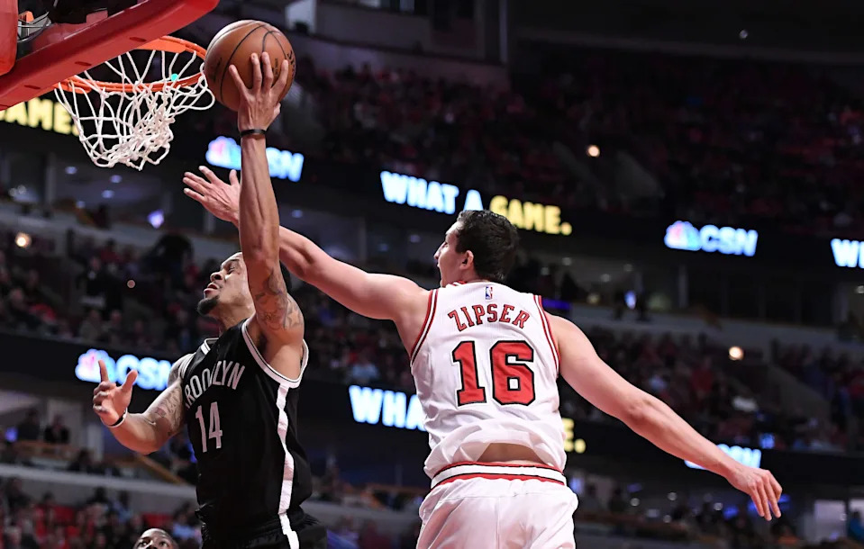 Apr 12, 2017; Chicago, IL, USA; Brooklyn Nets guard KJ McDaniels (14) shoots the ball against Chicago Bulls forward Paul Zipser (16) during the first half at the United Center. Mandatory Credit: Mike DiNovo-USA TODAY Sports