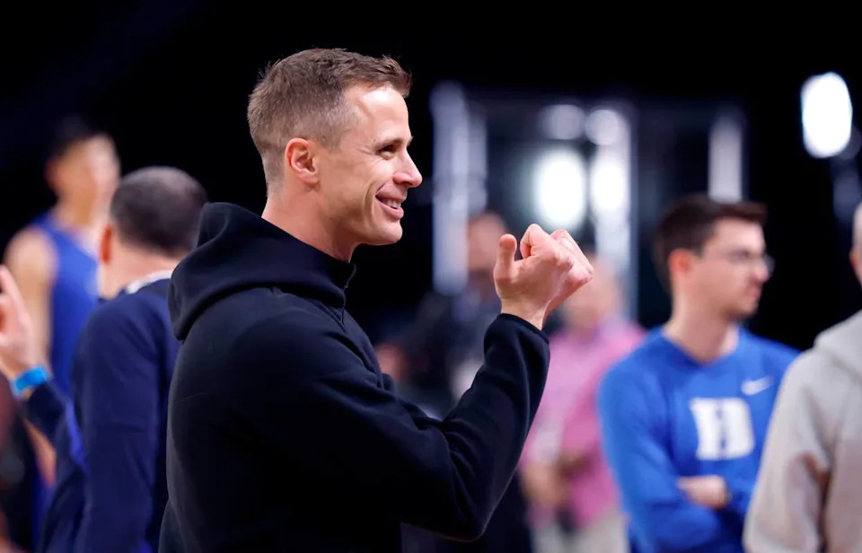Duke head coach Jon Scheyer responds to fans with the Bull City hand gesture during Duke’s practice at the Alamodome in San Antonio, Texas, Friday, April 4, 2025.