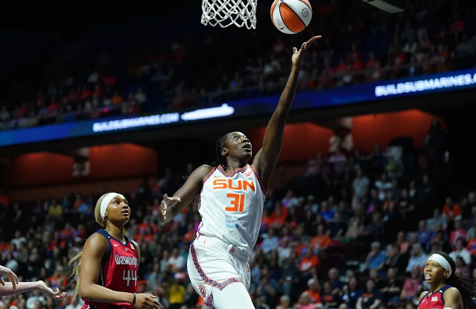 Connecticut Sun center Tina Charles (31) drives the ball to the basket against Washington Mystics forward Kiki Iriafen (44) in the first half at Mohegan Sun Arena on May 18, 2025.