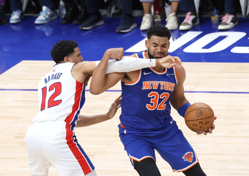 Tobias Harris #12 of the Detroit Pistons defends against Karl-Anthony Towns #32 of the New York Knicks during the second quarter.