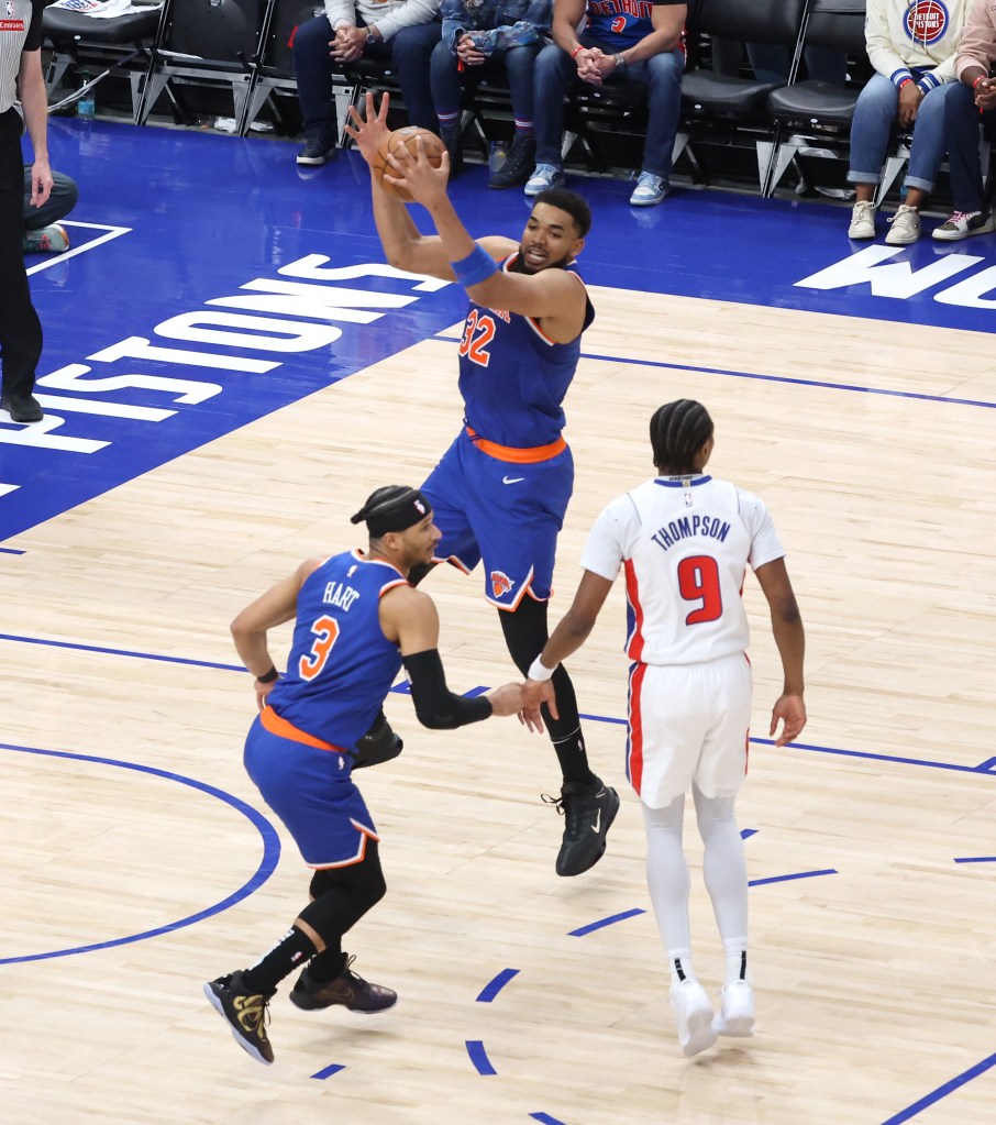 Karl-Anthony Towns #32 of the New York Knicks puts down a rebound during the third quarter.