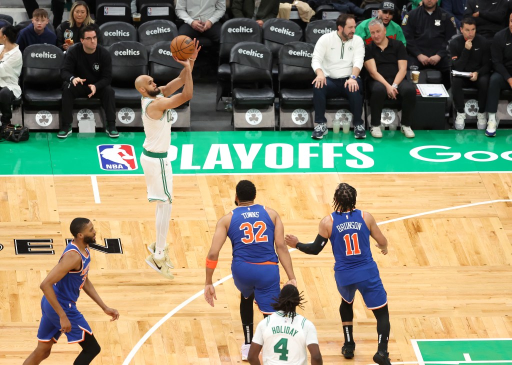 Derrick White #9 of the Boston Celtics puts up a three-point shot during the third quarter.