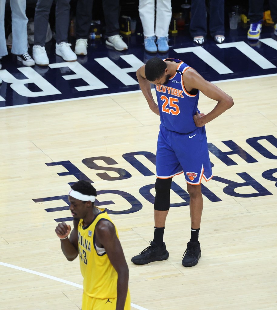 Mikal Bridges #25 of the New York Knicks reacts behind Pascal Siakam #43 of the Indiana Pacers during the fourth quarter.