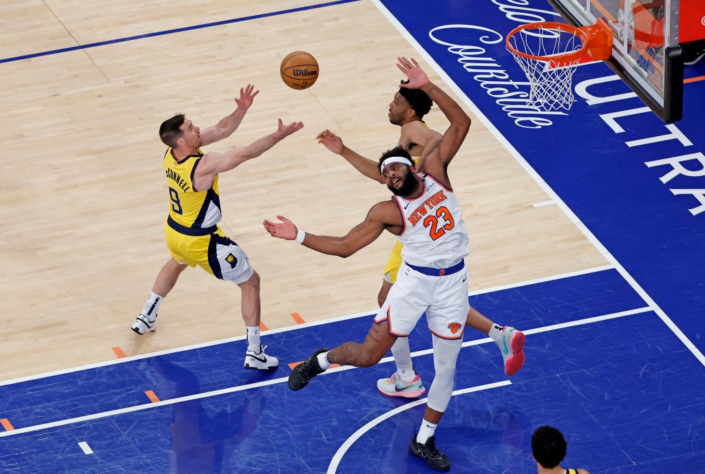 T.J. McConnell #9 jump for a rebound during the first quarter.