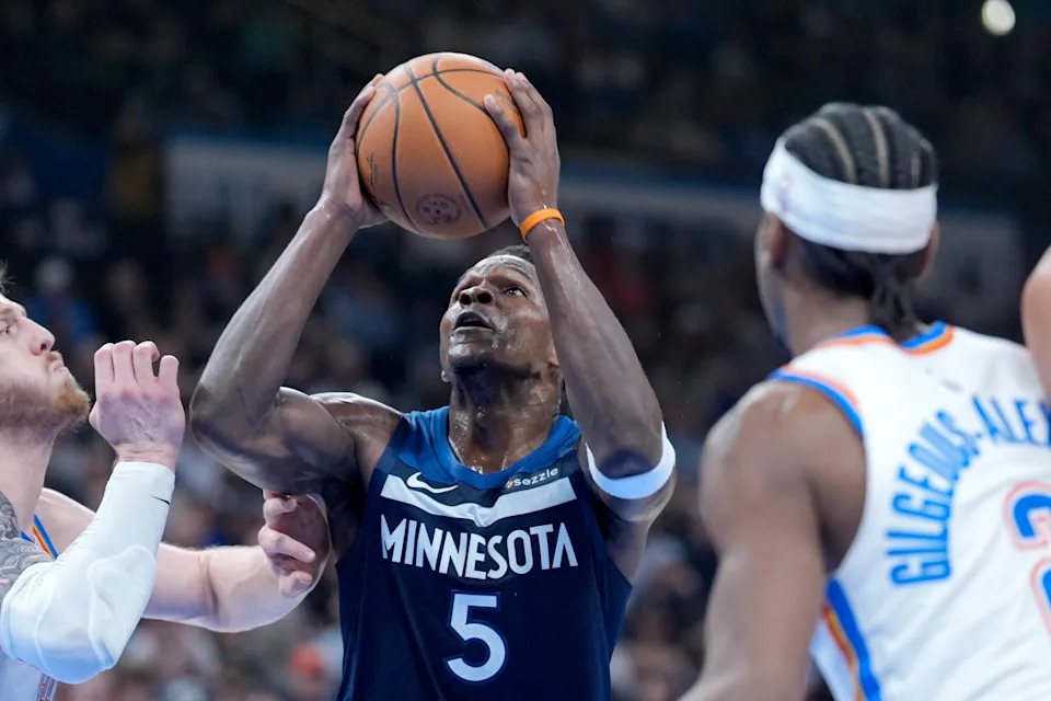 Minnesota guard Anthony Edwards (5) jumps to shoot past Oklahoma City center Isaiah Hartenstein (55) and Oklahoma City guard Shai Gilgeous-Alexander (2) in the second quarter during an NBA game between the Oklahoma City Thunder and the Minnesota Timberwolves at Paycom Center in Oklahoma City, on Monday, Feb. 24, 2025.
