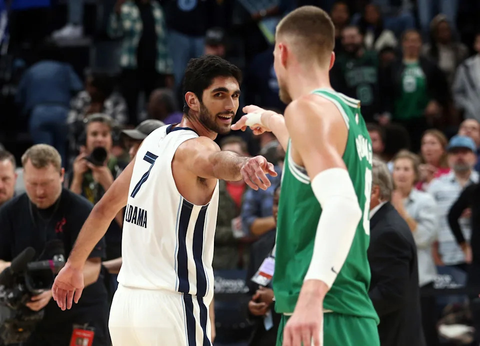 Nov 19, 2023; Memphis, Tennessee, USA; Memphis Grizzlies forward-center Santi Aldama (7) and Boston Celtics center Kristaps Porzingis (8) interact after a game at FedExForum. Mandatory Credit: Petre Thomas-USA TODAY Sports