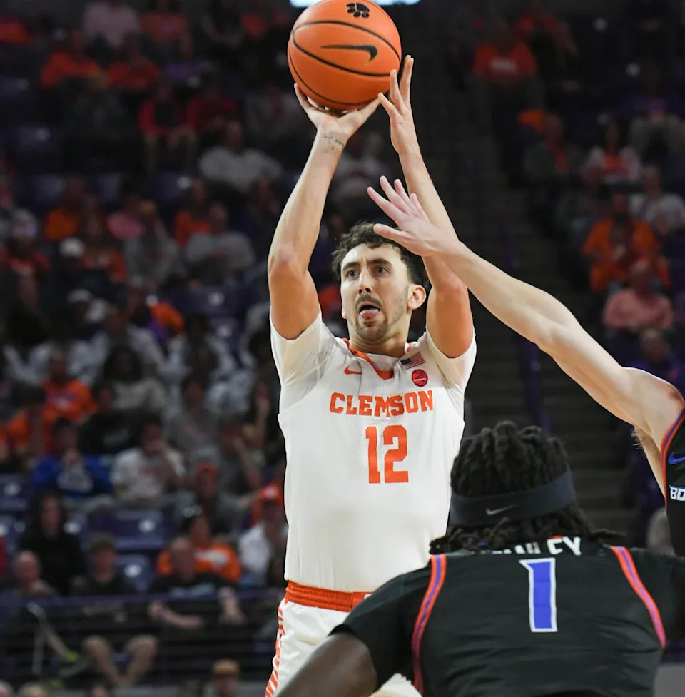 Clemson graduate Alex Hemenway (12) shoots near Boise State forward O'Mar Stanley (1) during the first half at Littlejohn Coliseum in Clemson, S.C. Sunday, November 19, 2023.