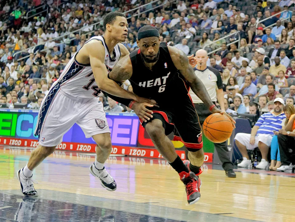 Apr 16, 2012; Newark, NJ, USA; Miami Heat small forward LeBron James (6) drives to the basket against New Jersey Nets shooting guard Gerald Green (14) at the Prudential Center. Miami Heat defeat the New Jersey Nets 101-98. Mandatory Credit: Jim O'Connor-USA TODAY Sports