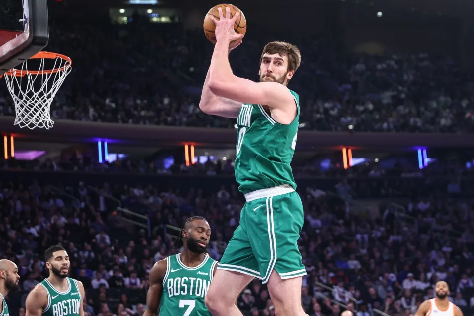 Feb 8, 2025; New York, New York, USA; Boston Celtics center Luke Kornet (40) grabs a rebound in the first quarter against the New York Knicks at Madison Square Garden. Mandatory Credit: Wendell Cruz-Imagn Images