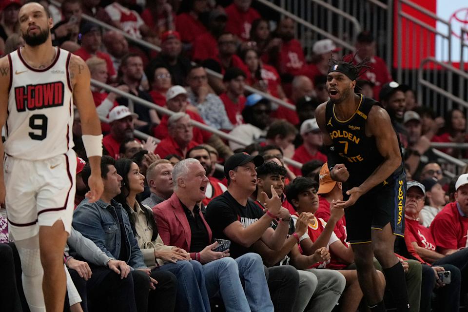 Golden State Warriors' Buddy Hield (7) reacts after making a three-pointer as Houston Rockets' Dillon Brooks (9) reacts during the first half of Game 7 of an NBA basketball first-round playoff series Sunday, May 4, 2025, in Houston. (AP Photo/Ashley Landis)