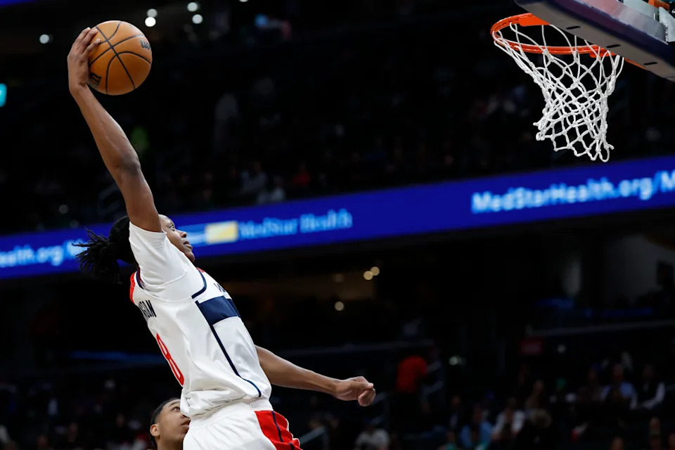 Oct 24, 2024; Washington, District of Columbia, USA; Washington Wizards guard Bub Carrington (8) attempts to dunk the ball against the Boston Celtics in the second half at Capital One Arena. Mandatory Credit: Geoff Burke-Imagn Images