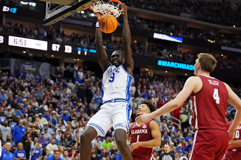 Mar 29, 2025; Newark, NJ, USA; Duke Blue Devils center Khaman Maluach (9) dunks the ball against Alabama Crimson Tide forward Grant Nelson (4) during the second half in the East Regional final of the 2025 NCAA tournament at Prudential Center. Mandatory Credit: Robert Deutsch-Imagn Images