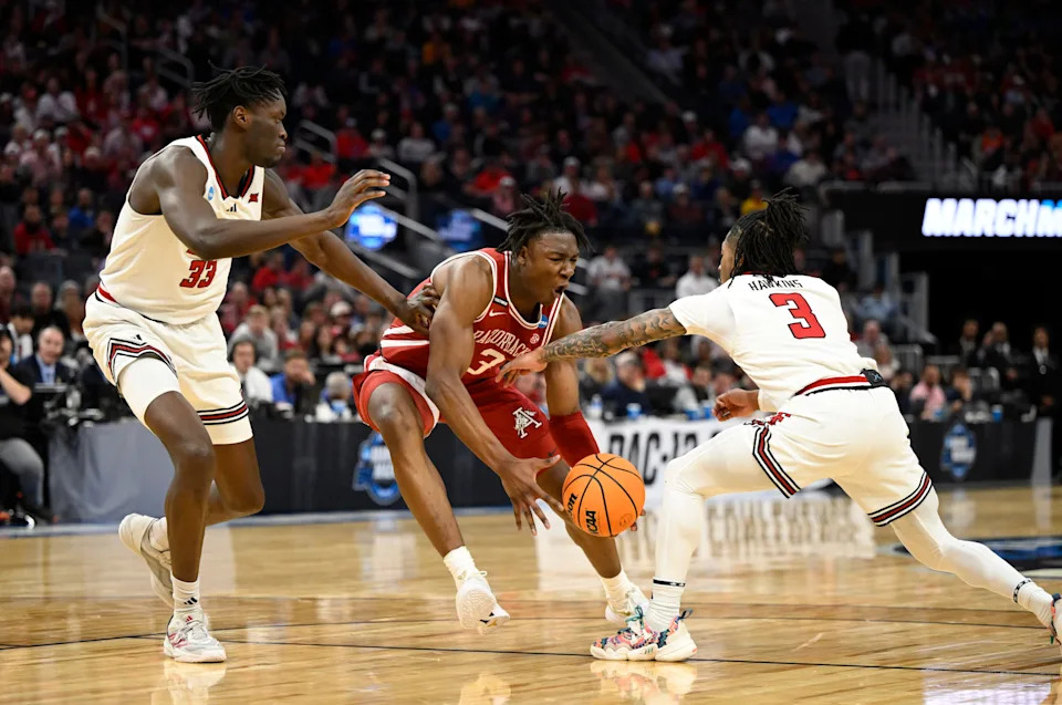 Mar 27, 2025; San Francisco, CA, USA; Arkansas Razorbacks forward Adou Thiero (3), Texas Tech Red Raiders forward Federiko Federiko (33) and guard Elijah Hawkins (3) battle for control of the ball during the first half during a West Regional semifinal of the 2025 NCAA tournament at Chase Center. Mandatory Credit: Eakin Howard-Imagn Images