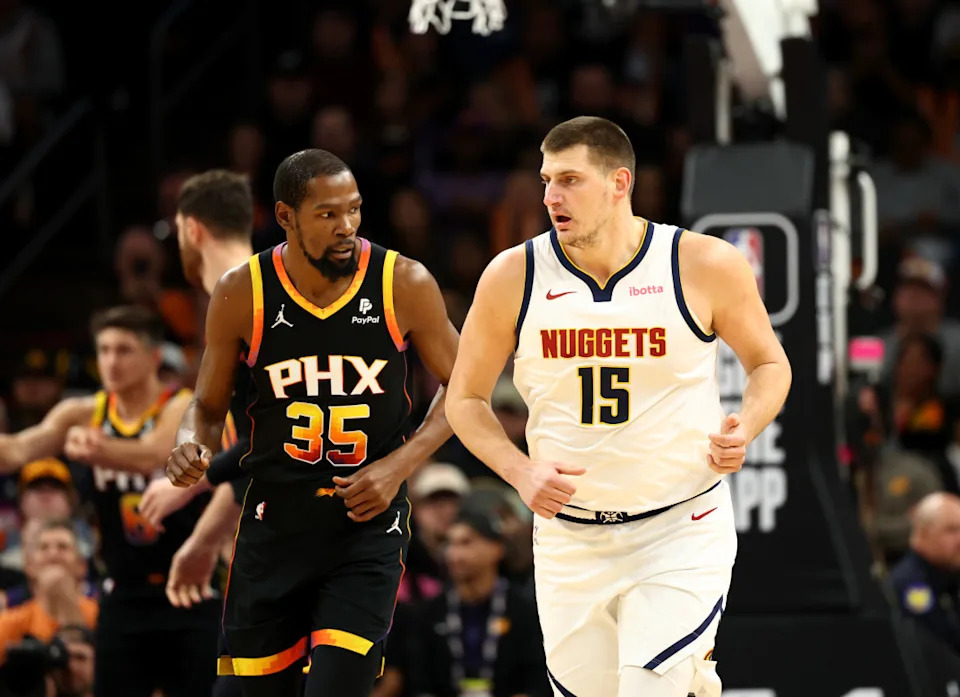 Dec 1, 2023; Phoenix, Arizona, USA; Denver Nuggets center Nikola Jokic (15) against Phoenix Suns forward Kevin Durant (35) at Footprint Center.© Mark J. Rebilas-USA TODAY Sports