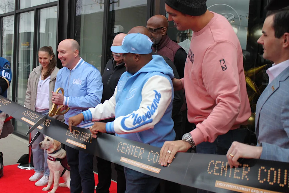 Cleveland Cavaliers coordinator and game day operations Ahmaad Crump (center) along with team legend Anderson Varejão (second from right) led the way for the opening of Center Court at Pinecrest at Orange Village.
