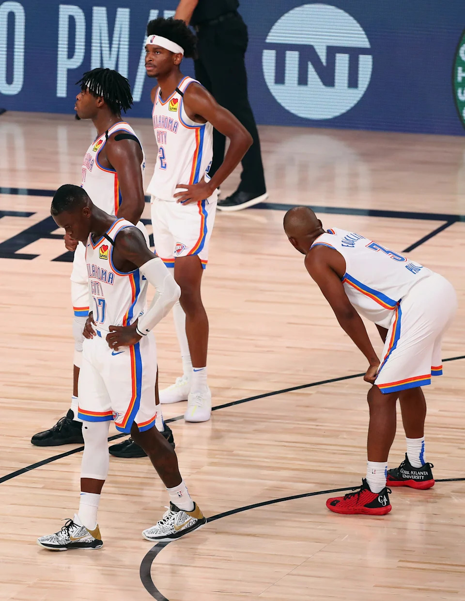 Sep 2, 2020; Lake Buena Vista, Florida, USA; Oklahoma City Thunder guard Dennis Schroder (17) and guard Luguentz Dort (5) and guard Shai Gilgeous-Alexander (2) and guard Chris Paul (3) react late in the second half of game seven of the first round of the 2020 NBA Playoffs against the Houston Rocketsat ESPN Wide World of Sports Complex. Mandatory Credit: Kim Klement-USA TODAY Sports