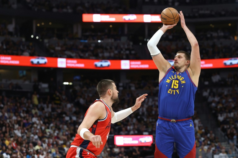 Nikola Jokic of the Denver Nuggets shoots the ball against Ivica Zubac in the Nuggets