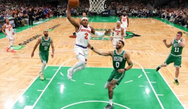 Miles McBride of the New York Knicks drives to the basket against Jayson Tatum in the Knicks