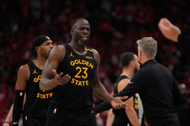 Golden State Warriors' Draymond Green (23) walks to the bench after a technical foul during the first half of Game 7 of an NBA basketball first-round playoff series against the Houston Rockets Sunday, May 4, 2025, in Houston. (AP Photo/Ashley Landis)