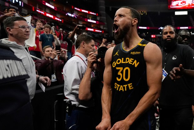 Golden State Warriors' Stephen Curry (30) celebrates after Game 7 of an NBA basketball first-round playoff series against the Houston Rockets Sunday, May 4, 2025, in Houston. (AP Photo/Ashley Landis)