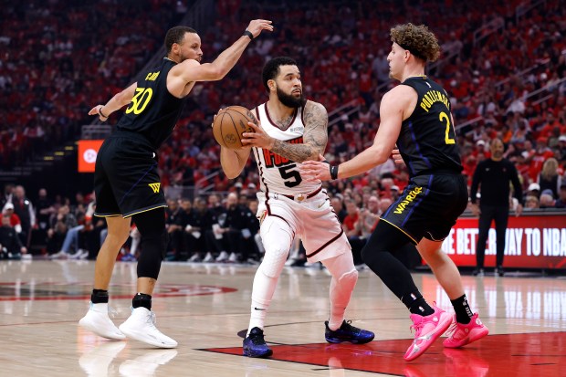 Stephen Curry #30 and Brandin Podziemski #2 of the Golden State Warriors defend against Fred VanVleet #5 of the Houston Rockets during the first quarter in Game Seven of the Western Conference First Round NBA Playoffs at Toyota Center on May 04, 2025 in Houston, Texas. (Photo by Tim Warner/Getty Images)