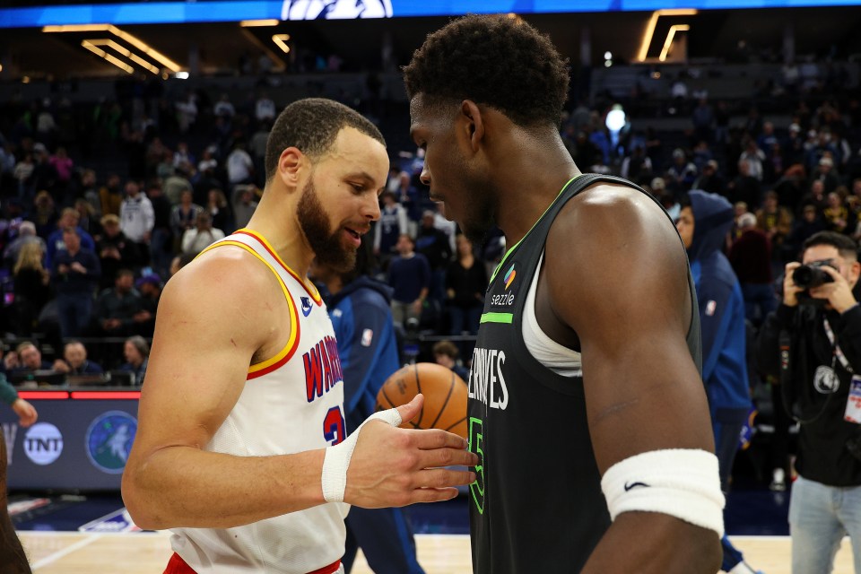 MINNEAPOLIS, MINNESOTA - JANUARY 15: Stephen Curry #30 of the Golden State Warriors and Anthony Edwards #5 of the Minnesota Timberwolves shake hands after the game at Target Center on January 15, 2025 in Minneapolis, Minnesota. The Warriors defeated the Timberwolves 116-115. NOTE TO USER: User expressly acknowledges and agrees that, by downloading and or using this photograph, User is consenting to the terms and conditions of the Getty Images License Agreement. (Photo by David Berding/Getty Images)
