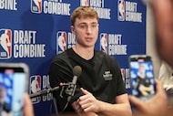 Cooper Flagg talks to media at the 2025 NBA basketball draft combine in Chicago, Wednesday,...