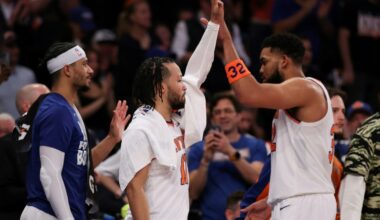 Jalen Brunson (center) high fives with teammate Karl-Anthony Towns as the New York Knicks rout the Boston Celtics to reach the NBA Eastern Conference finals (AL BELLO)