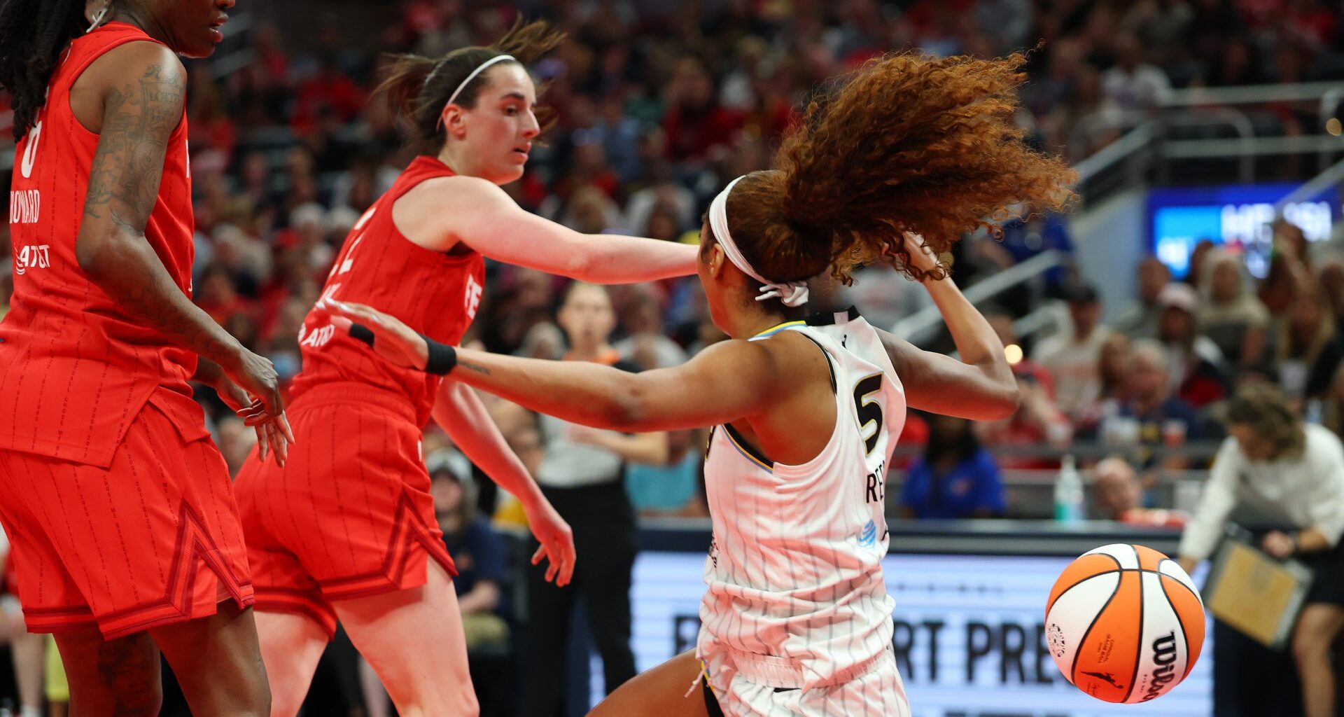 Angel Reese held back by referee after Caitlin Clark draws flagrant foul for shove in fiery Fever-Sky contest