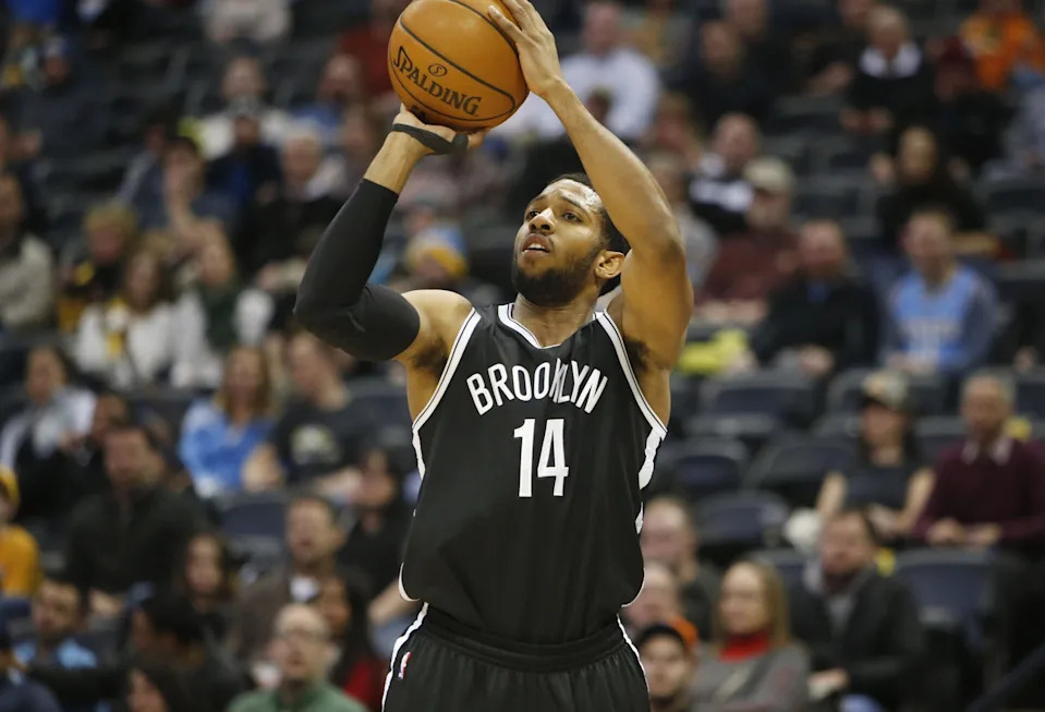 Feb 23, 2015; Denver, CO, USA; Brooklyn Nets guard Darius Morris (14) shoots the ball during the first half against the Denver Nuggets at Pepsi Center. Mandatory Credit: Chris Humphreys-USA TODAY Sports